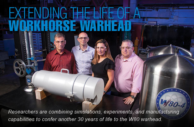Engineers pose with a model of the W80-4.