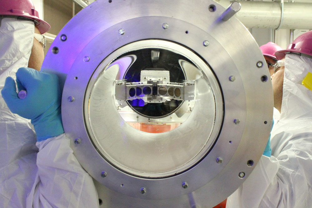 Target area operators remove the XTRRA (x-ray transport and radiation response analysis) diagnostic assembly from a DIM following an experiment. 