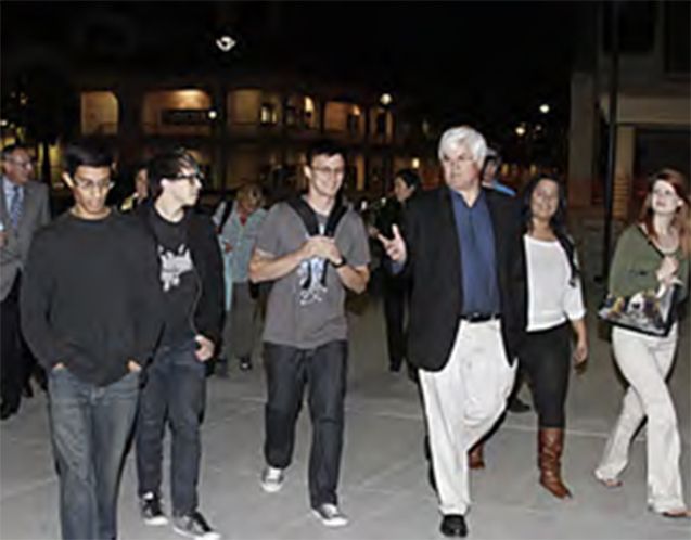 Students and Laboratory Director Partney Albright touring the Las Positas campus at night.