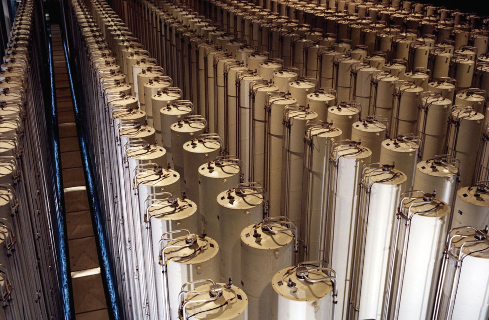 Hundreds of tall cylinders arranged pair-wise in rows, photographed from an elevated vantage point