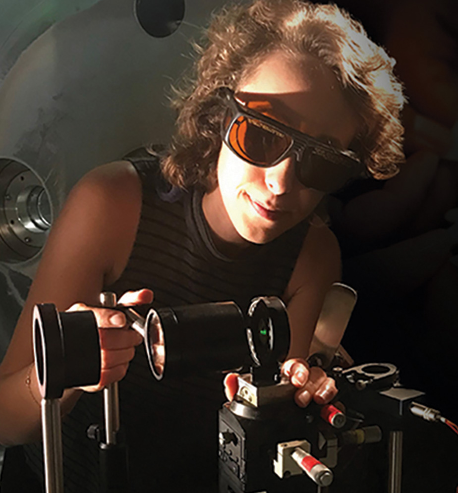 scientist wearing protective eye wear and working with laboratory equipment