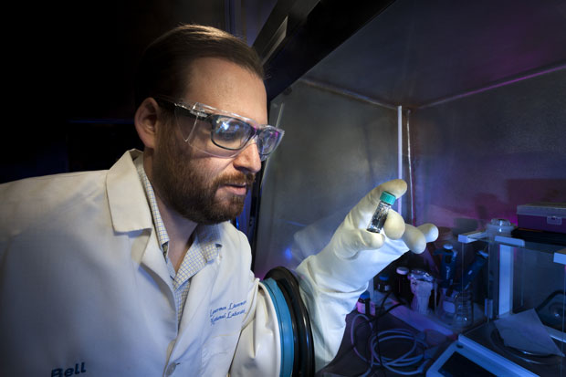 Livermore materials scientist Lars Voss holds a vial containing selenium–iodine. This semiconducting material may be useful for developing long-lasting, reliable radioisotope batteries. (Photo by Randy Wong.)   