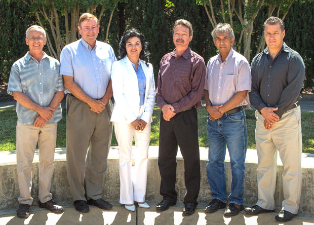 (left) Development team for the Smart Real-Time Inventory System Based on Long-Range, Battery-Free, Radio Frequency Harsh Environment Tag (HET) system: (from left) Jimmie Jessup, Del Ekels, Rick Twogood, Faranak Nekoogar, Dave Weirup, Farid Dowla, and Don Mendonsa. (top) The HET system enables first responders to quickly and more efficiently track inventories of emergency equipment while working in harsh environments.
