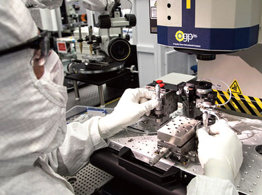A target fabrication technician uses an optical coordinate measuring machine to align a capsule inside a hohlraum for an inertial-confinement-fusion (ICF) target.