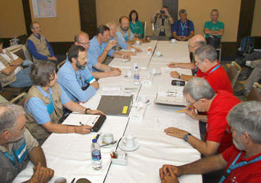 At the end of IFE14, members of the CTBTO inspection team (left, blue shirts) meet with members of the inspected-state party (red shirts) to deliver the preliminary findings.
