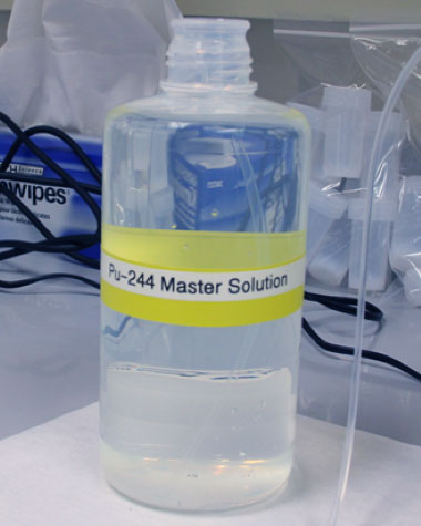 Following several stages of purification, the team prepared a master solution of plutonium-244. Five-milliliter aliquots of the solution were dispensed into 190 (30-milliliter capacity) fluorinated ethylene propylene bottles, which will eventually be sent to IAEA’s Network of Analytical Laboratories.