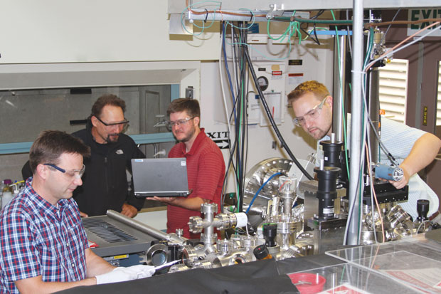 Livermore researchers Jonathan Lee, Juergen Biener, Brandon Wood, and Michael Bagge-Hansen test cell components for ultrahigh vacuum capability in preparation for x-ray spectroscopy measurements of supercapacitor electrode behavior at Lawrence Berkeley’s Advanced Light Source.